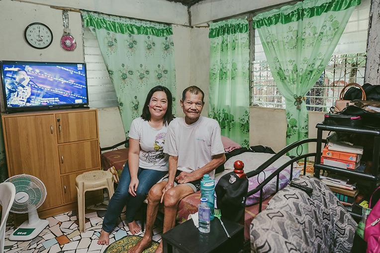 Joan and her father Juan in their home built during the 1999 Carter Work Project in Philippines