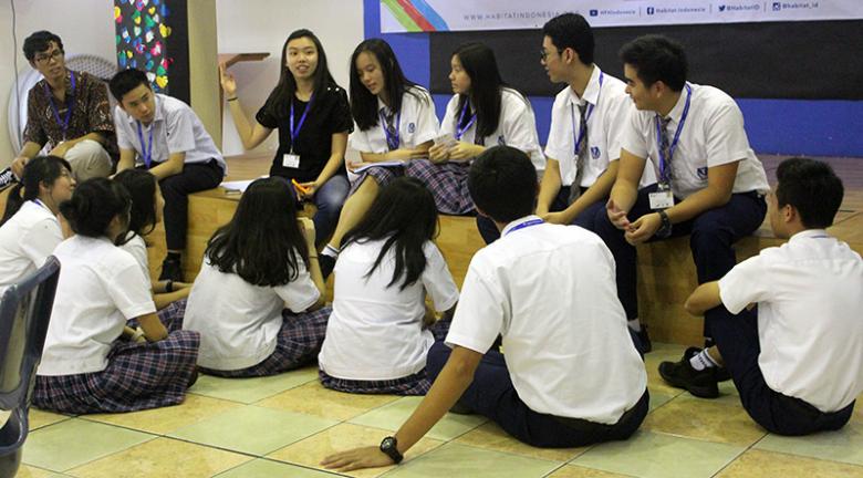 A country trainer with participants at Leadership Academy training in Indonesia.