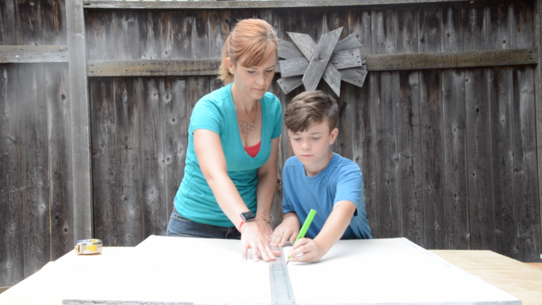 Jack and Theresa mark the board.