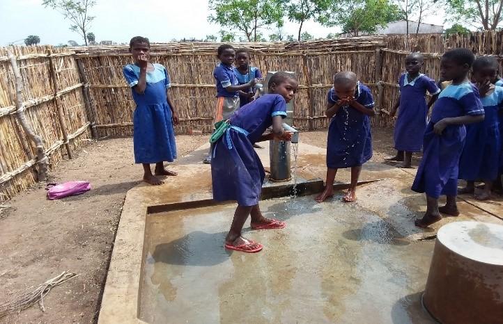 Photo: Chickwawa’s Liwiro Junior Primary School students drinking clean water from a water point