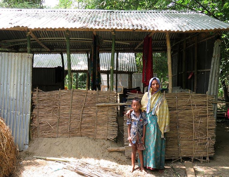 Samala (right) and her son Aminul outside their temporary shelter in Jamalpur district, Bangladesh