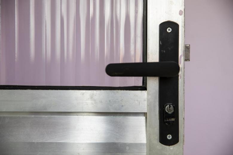 open door against a purple wall.