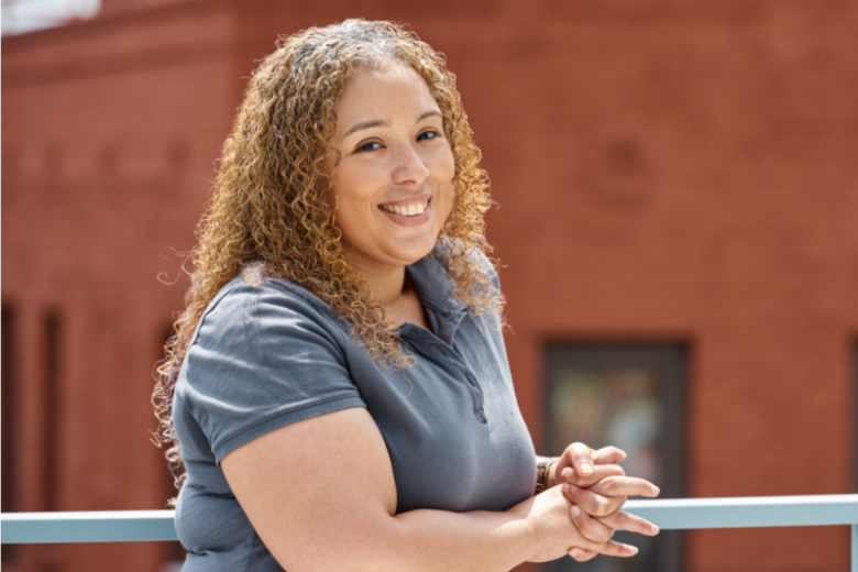 Portrait photo of Janet smiling.