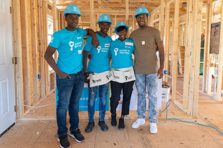 Krushetta and her sons on the build site of their Habitat home.