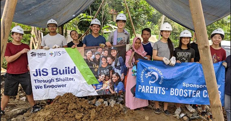 Vas and Diego with fellow volunteers from Jakarta Intercultural School