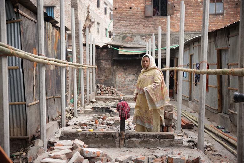 Sumi at the site where five houses were razed in a fire in Duaripara