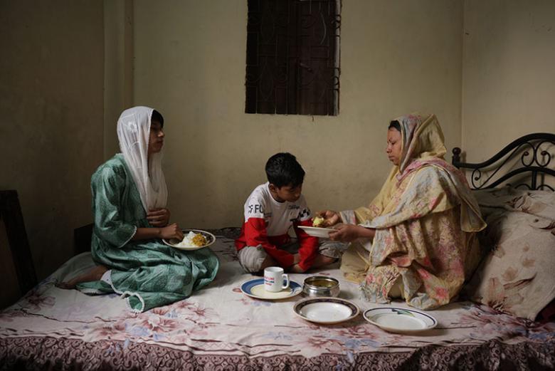 Sumi and her children having lunch at home