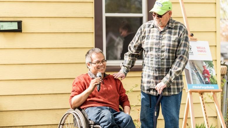 Robert with his adult son who uses a wheelchair.