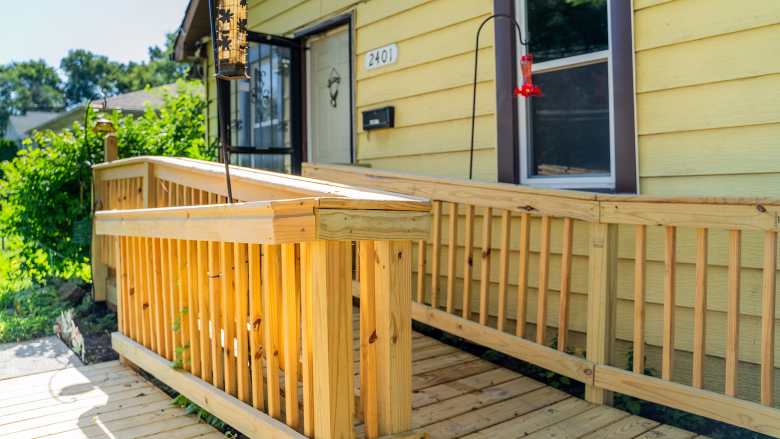 A brand new wooden wheelchair ramp connected to Robert's home.