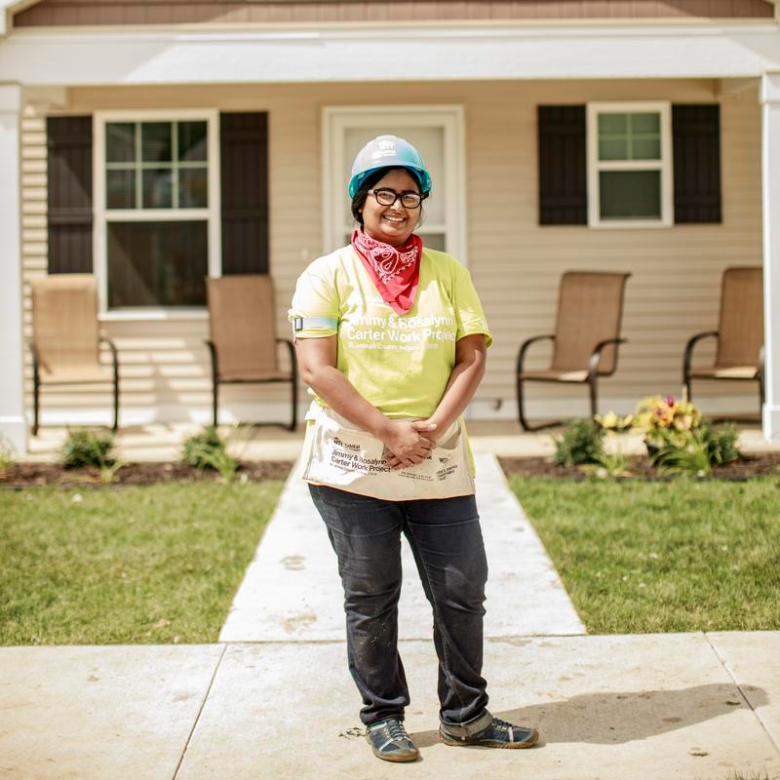 homeowner in front of new home