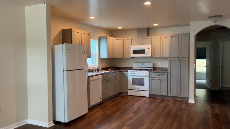 Kitchen with white appliances.