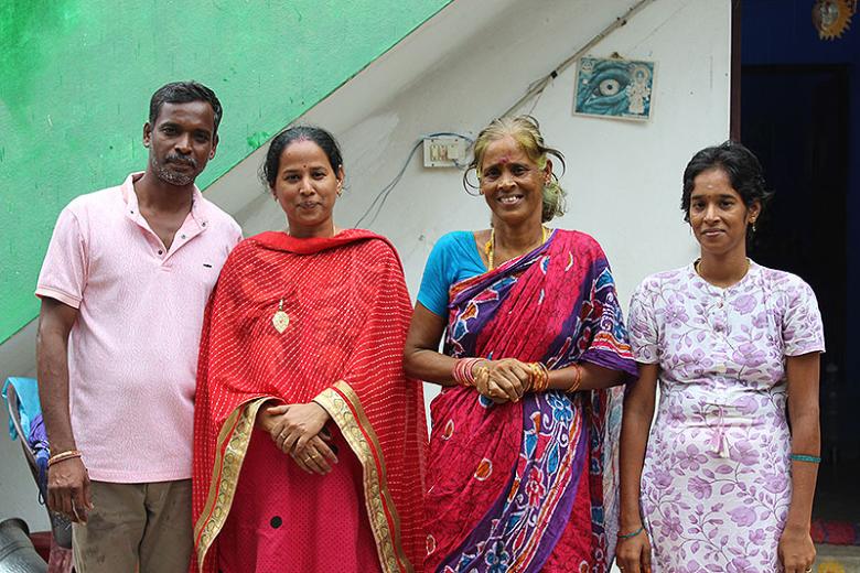 Sandhiya (3rd from left) with her family outside her home rebuilt after 2004 tsunami