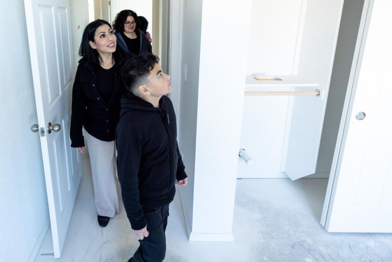Family walking through their new home.