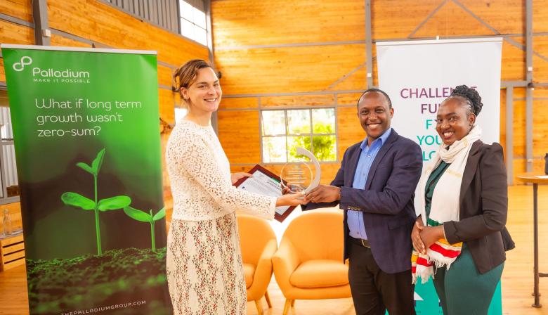 Amarins Gerlofsma, Diplomat, Embassy of the Netherlands, Nairobi presenting certificates to the Habitat consortium represented by Masua Mutua, Regional Director for Eastern and Southern Africa at the Terwilliger Center for Innovation in Shelter and Africa Finance Assistant Valerie Kizito.