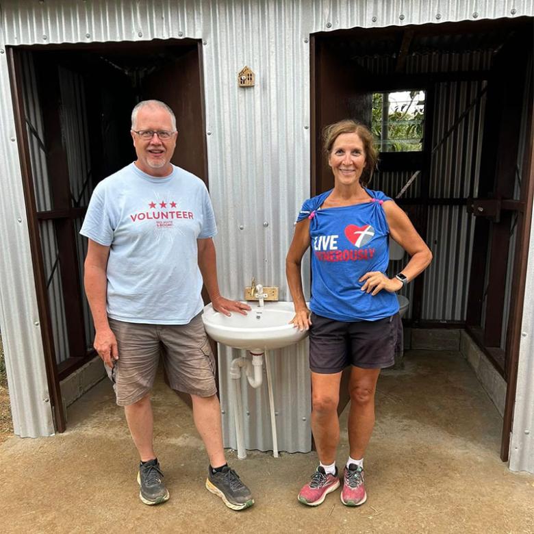 Kirk (left) at his first Global Village build in Fiji, with team leader Jackie