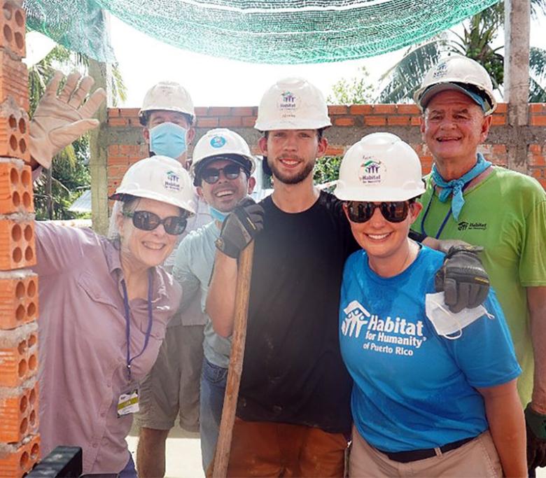 Nickolas (center) with volunteers from his Global Village team