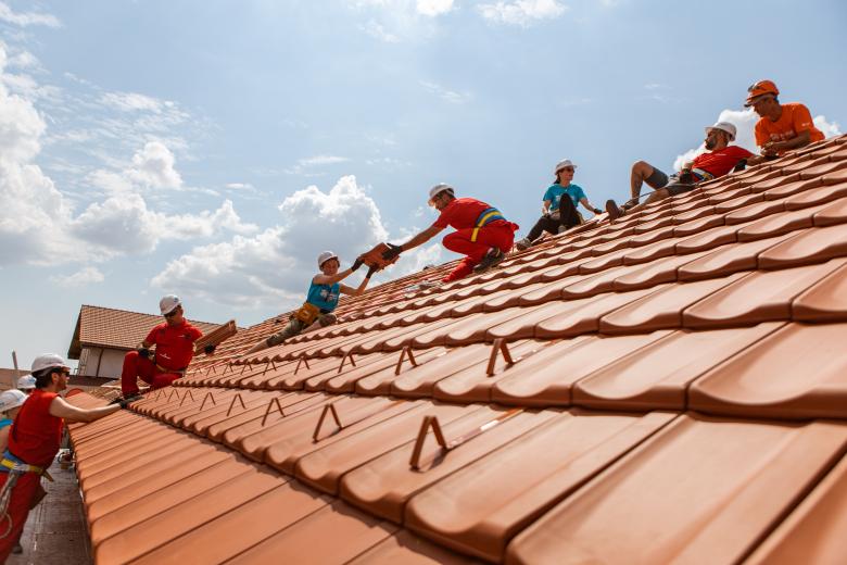 Volunteers working on a rooftop