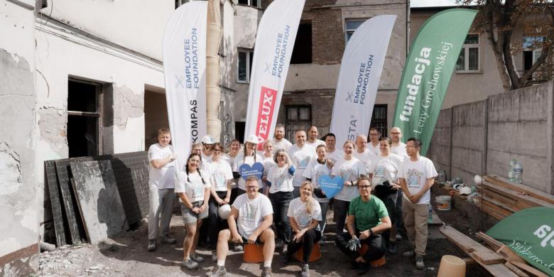 Corporate volunteer group posing for a photo in Poland
