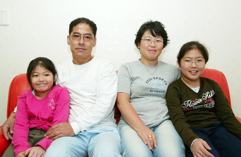 Korean homeowner Jungbae and his family in 2004 photo
