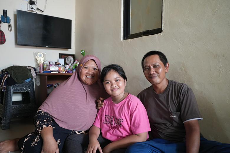 Tasnih, daughter Karos Malasari and Rusdiandi at home in Batam, Indonesia 